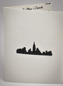 I had a little fun and embossed the front of this card with a city skyline.